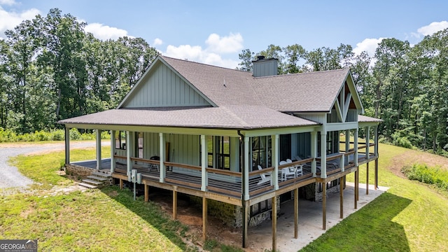 4384 Round Pond Rd, Lafayette, GA 30728 - rear view of house with a shingled roof, a chimney, board and batten siding, a yard, and a wooden deck