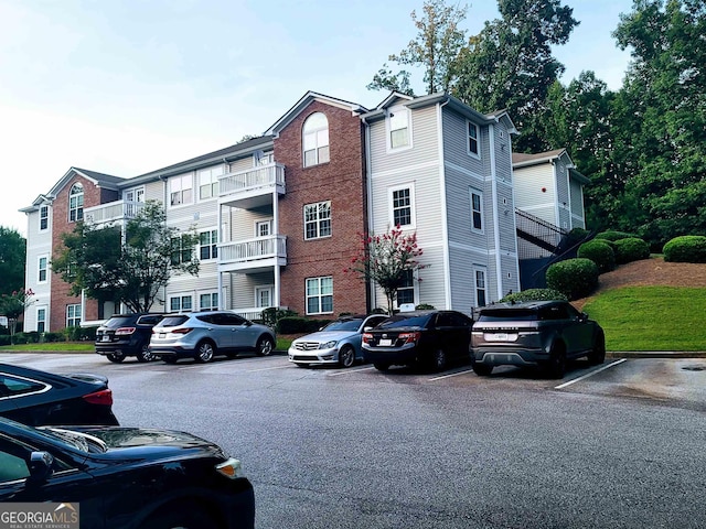 1392 Orchard Park Dr, Stone Mountain, GA 30083 - view of building exterior with uncovered parking