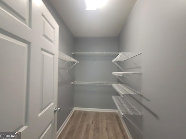 1392 Orchard Park Dr, Stone Mountain, GA 30083 - spacious closet featuring wood finished floors
