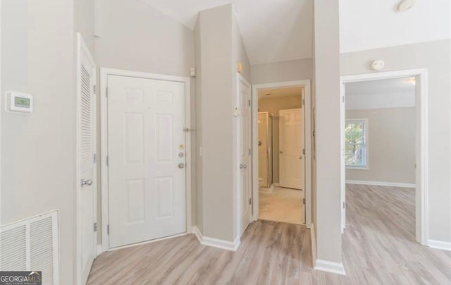 1392 Orchard Park Dr, Stone Mountain, GA 30083 - entrance foyer with light wood-style flooring and baseboards