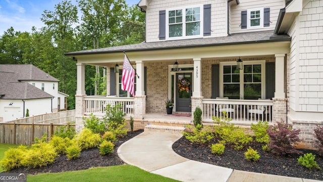 4395 Capstone Ct, Roswell, GA 30075 - doorway to property featuring covered porch and brick siding