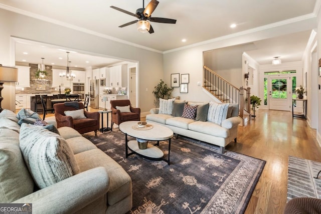 4395 Capstone Ct, Roswell, GA 30075 - living room with stairway, ceiling fan, wood finished floors, a chandelier, and recessed lighting