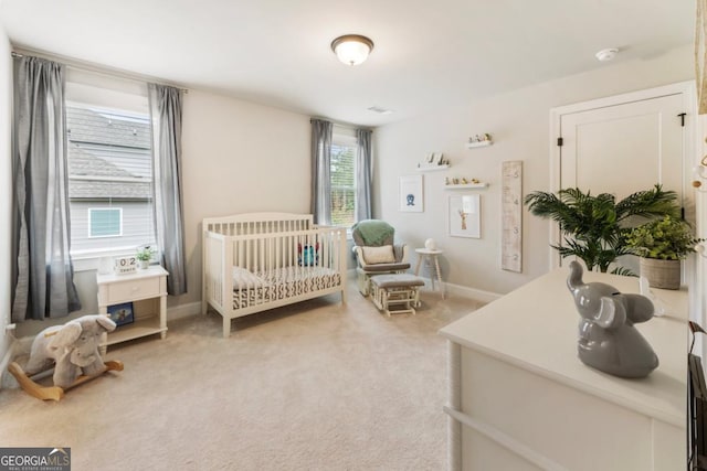 4395 Capstone Ct, Roswell, GA 30075 - bedroom featuring light carpet and a crib