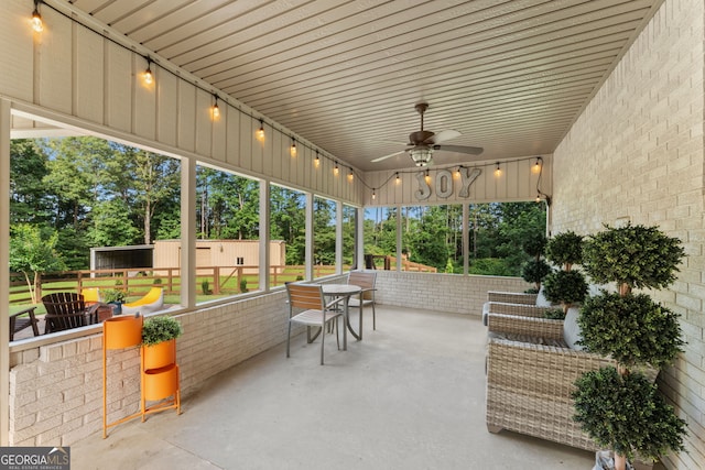 980 Casteel Rd, Powder Springs, GA 30127 - sunroom / solarium featuring ceiling fan and view of wooded area