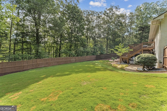 980 Casteel Rd, Powder Springs, GA 30127 - fenced backyard with stairway and a wooden deck