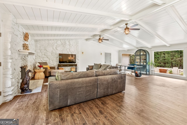 980 Casteel Rd, Powder Springs, GA 30127 - living area featuring a ceiling fan, dark wood finished floors, and a stone fireplace