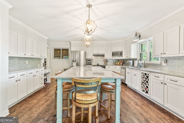 980 Casteel Rd, Powder Springs, GA 30127 - kitchen with stainless steel appliances, decorative backsplash, white cabinetry, dark wood-style flooring, and light stone counters