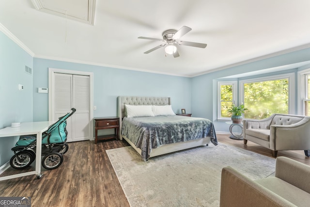 980 Casteel Rd, Powder Springs, GA 30127 - bedroom featuring attic access, dark wood-style flooring, crown molding, ceiling fan, and a closet