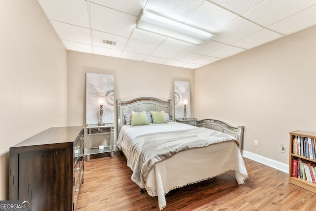 980 Casteel Rd, Powder Springs, GA 30127 - bedroom featuring a drop ceiling and wood finished floors