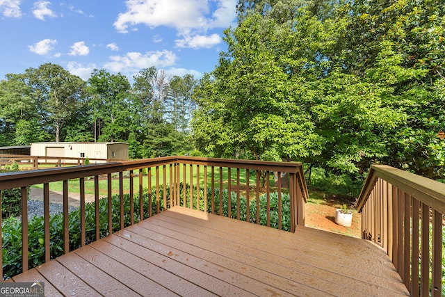 980 Casteel Rd, Powder Springs, GA 30127 - wooden terrace featuring an outbuilding and view of scattered trees