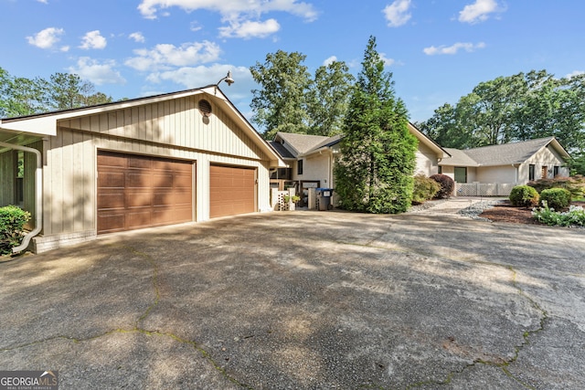 980 Casteel Rd, Powder Springs, GA 30127 - view of front facade with concrete driveway and a garage