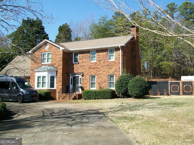 250 Tommy Aaron Dr, Gainesville, GA 30506 - view of front of property featuring a chimney, brick siding, and driveway