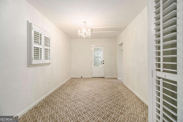 2983 Peek Rd NW, Atlanta, GA 30318 - empty room featuring a chandelier and baseboards