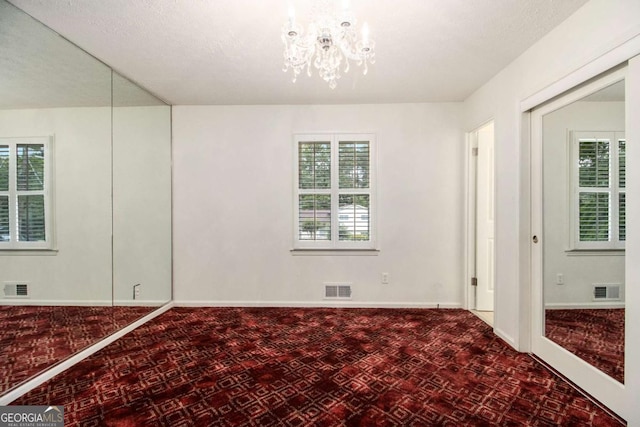2983 Peek Rd NW, Atlanta, GA 30318 - unfurnished room with a chandelier and tile patterned floors