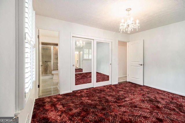 2983 Peek Rd NW, Atlanta, GA 30318 - unfurnished bedroom featuring a chandelier and ensuite bathroom