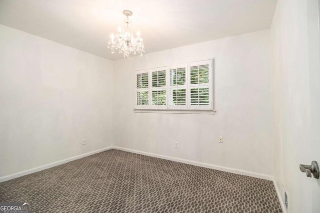 2983 Peek Rd NW, Atlanta, GA 30318 - carpeted spare room featuring a chandelier and baseboards