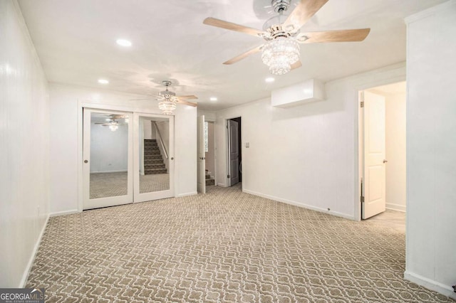 2983 Peek Rd NW, Atlanta, GA 30318 - carpeted spare room featuring a ceiling fan, recessed lighting, and stairway