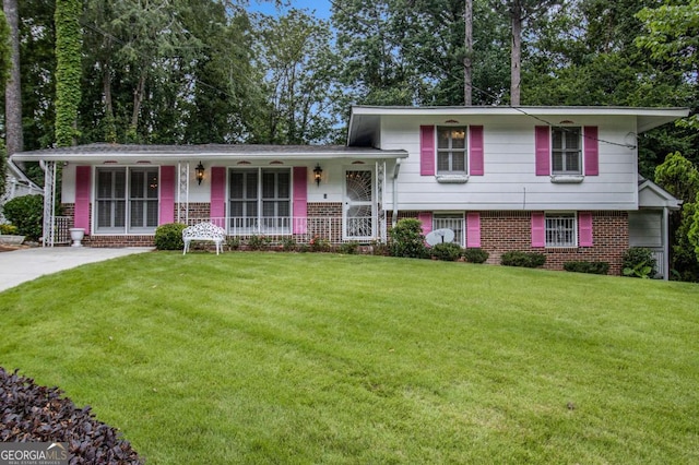 2983 Peek Rd NW, Atlanta, GA 30318 - tri-level home featuring brick siding, a porch, and a front lawn