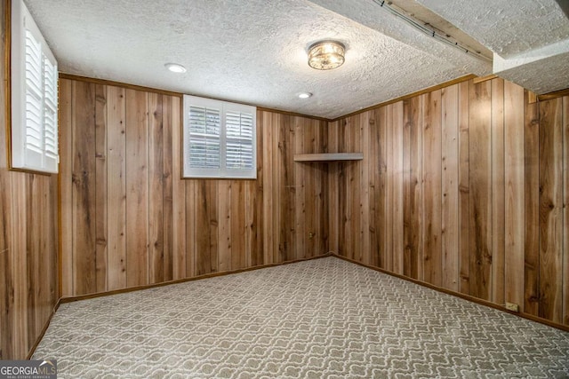2983 Peek Rd NW, Atlanta, GA 30318 - basement featuring wood walls, carpet, and a textured ceiling