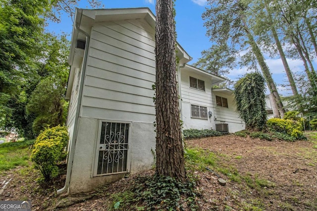 2983 Peek Rd NW, Atlanta, GA 30318 - view of side of home with a central air condition unit