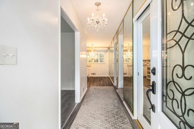 2983 Peek Rd NW, Atlanta, GA 30318 - hall with a chandelier and wood finished floors