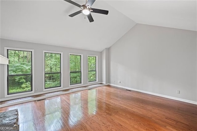 1279 Colony Pl, Marietta, GA 30068 - empty room featuring plenty of natural light, vaulted ceiling, ceiling fan, and wood-type flooring