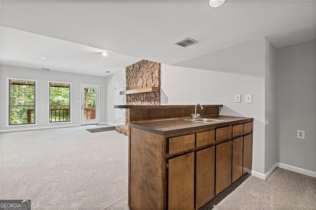 1279 Colony Pl, Marietta, GA 30068 - kitchen featuring light carpet, dark countertops, a peninsula, and open floor plan