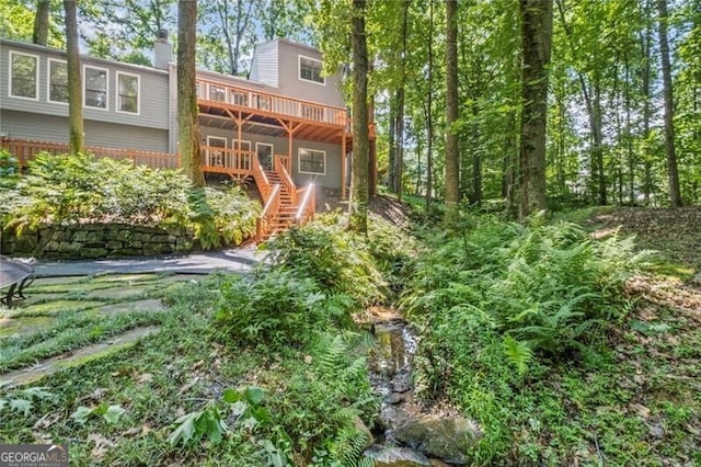 1279 Colony Pl, Marietta, GA 30068 - rear view of property with a deck, stairs, a chimney, and brick siding