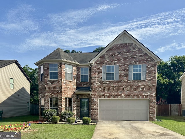 942 Amelia Dr, Byron, GA 31008 - traditional-style home featuring a garage, driveway, brick siding, and roof with shingles