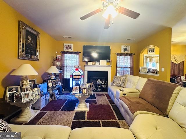 942 Amelia Dr, Byron, GA 31008 - living area with ceiling fan and a fireplace