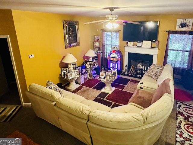 942 Amelia Dr, Byron, GA 31008 - living room with ceiling fan and a fireplace