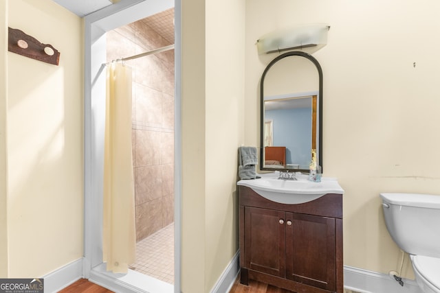 6567 Tahiti Way, Flowery Branch, GA 30542 - full bathroom featuring a shower stall, vanity, and wood finished floors