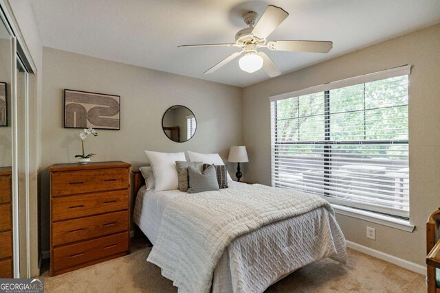 211 N Ave Unit 1317, Athens, GA 30601 - bedroom with light colored carpet, a ceiling fan, and a closet