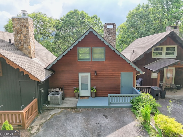 33 Berkshire Ln, Dillard, GA 30537 - rear view of house with a chimney, a patio, a deck, and a shingled roof