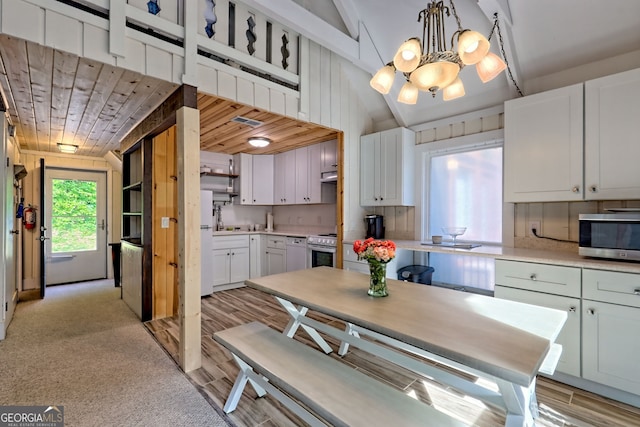 33 Berkshire Ln, Dillard, GA 30537 - kitchen featuring appliances with stainless steel finishes, white cabinets, a chandelier, light countertops, and wooden ceiling