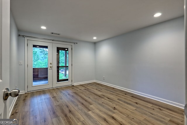 33 Berkshire Ln, Dillard, GA 30537 - spare room with french doors, wood finished floors, and recessed lighting