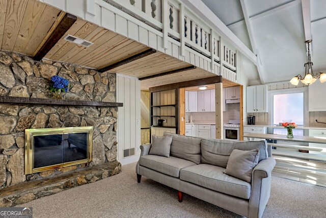 33 Berkshire Ln, Dillard, GA 30537 - living room featuring carpet flooring, a wooden ceiling with exposed beams, a chandelier, and a fireplace