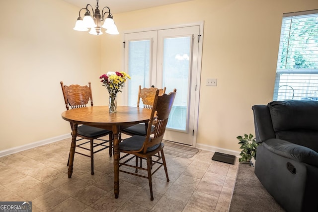 126 Savannah Way, Milner, GA 30257 - dining room with plenty of natural light and a chandelier