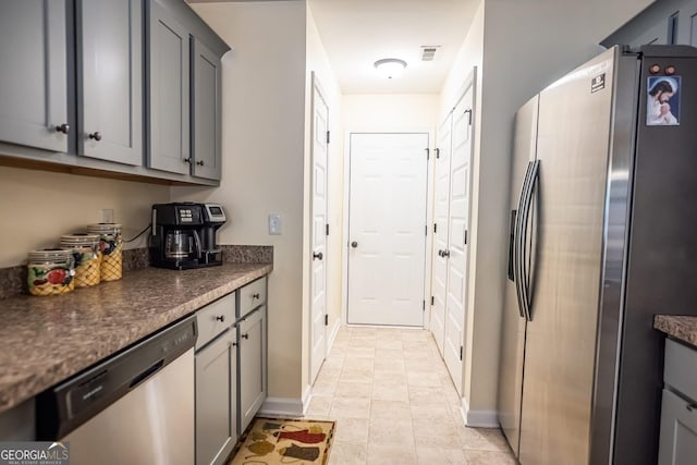 126 Savannah Way, Milner, GA 30257 - kitchen with appliances with stainless steel finishes, gray cabinetry, and dark countertops
