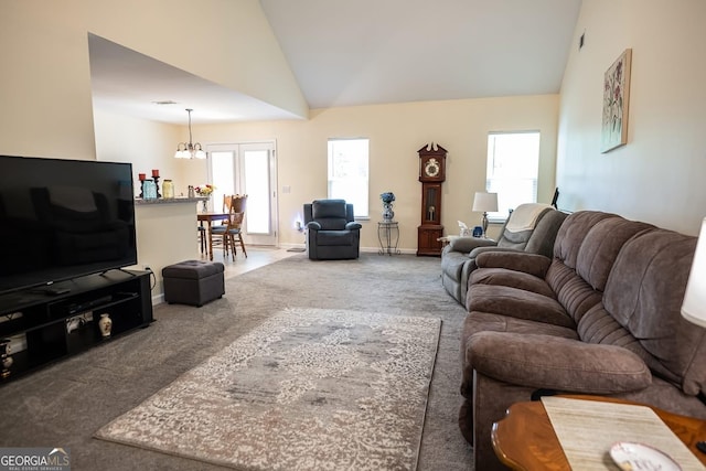 126 Savannah Way, Milner, GA 30257 - carpeted living room featuring a chandelier and lofted ceiling