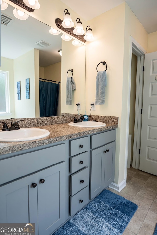 126 Savannah Way, Milner, GA 30257 - bathroom with double vanity and tile patterned floors