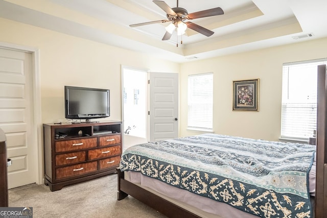 126 Savannah Way, Milner, GA 30257 - bedroom with light colored carpet, a raised ceiling, and a ceiling fan