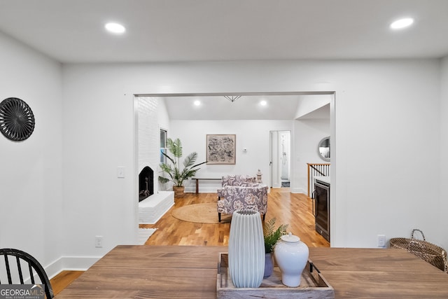 685 Pinecrest Dr, Athens, GA 30605 - dining space with a fireplace, recessed lighting, and light wood-style flooring