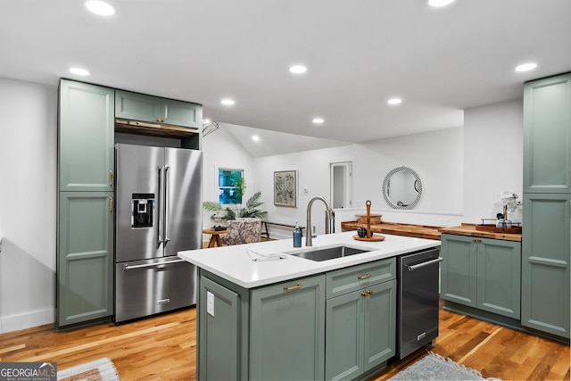 685 Pinecrest Dr, Athens, GA 30605 - kitchen with green cabinets, high quality fridge, dishwashing machine, a kitchen island with sink, and light wood-type flooring
