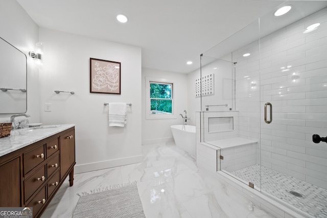 685 Pinecrest Dr, Athens, GA 30605 - bathroom with vanity, a freestanding tub, a stall shower, marble finish flooring, and recessed lighting