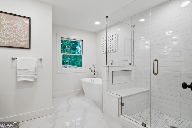 685 Pinecrest Dr, Athens, GA 30605 - bathroom featuring marble finish floors, a shower stall, a freestanding bath, and recessed lighting