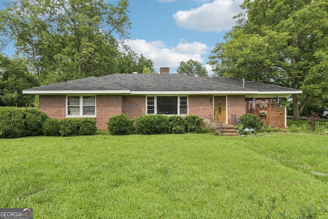 601 Crawfordville Rd, Union Point, GA 30669 - ranch-style house with a front lawn, a chimney, and brick siding