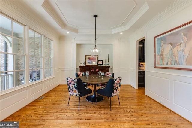 930 Shepards Ct, Roswell, GA 30075 - dining room with a decorative wall, crown molding, light wood-style floors, and a tray ceiling