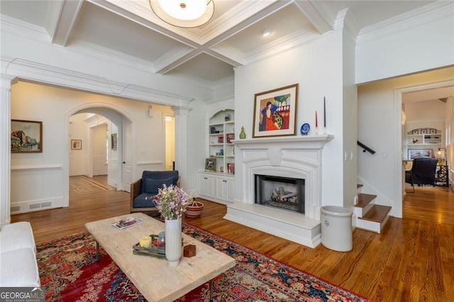 930 Shepards Ct, Roswell, GA 30075 - living room with wood finished floors, ornamental molding, arched walkways, coffered ceiling, and a fireplace with raised hearth
