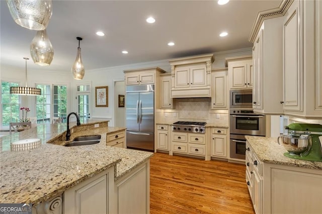 930 Shepards Ct, Roswell, GA 30075 - kitchen with built in appliances, cream cabinetry, crown molding, decorative backsplash, and light wood-type flooring